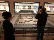 Scenes from the textile portion of the "Tsinghua Treasures: Exhibition of Tsinghua University Art Museum Collection." (L-R) Ge Xiuzhi and Jon Kay. December 8, 2017. Photograph by Jason Jackson.